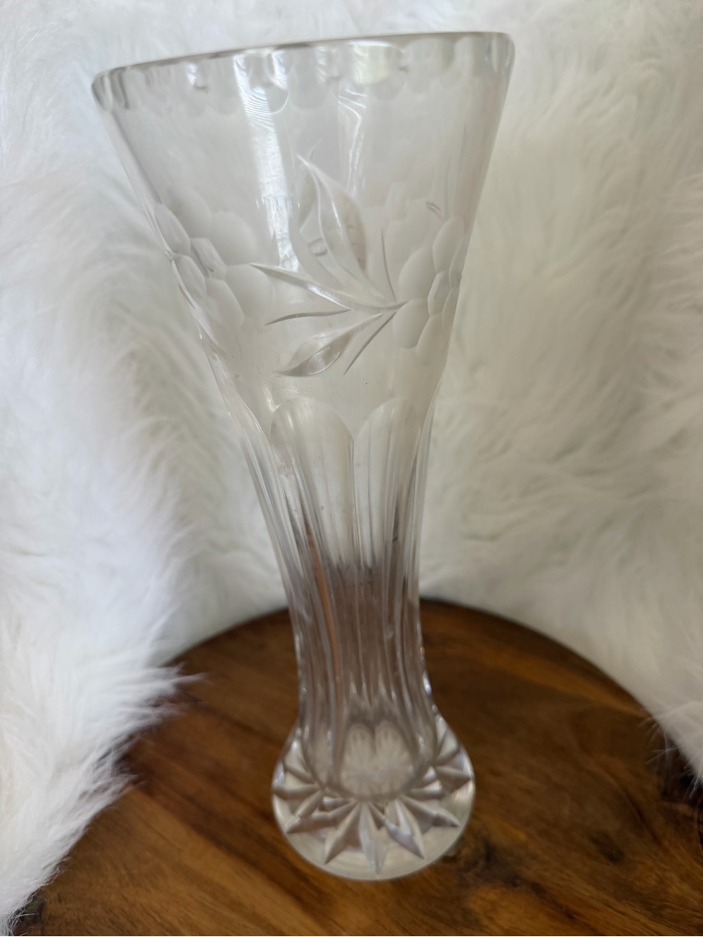 Etched crystal glass vase with floral motifs.